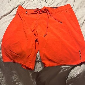 DAKINE, size 31, red swim trunks, never worn